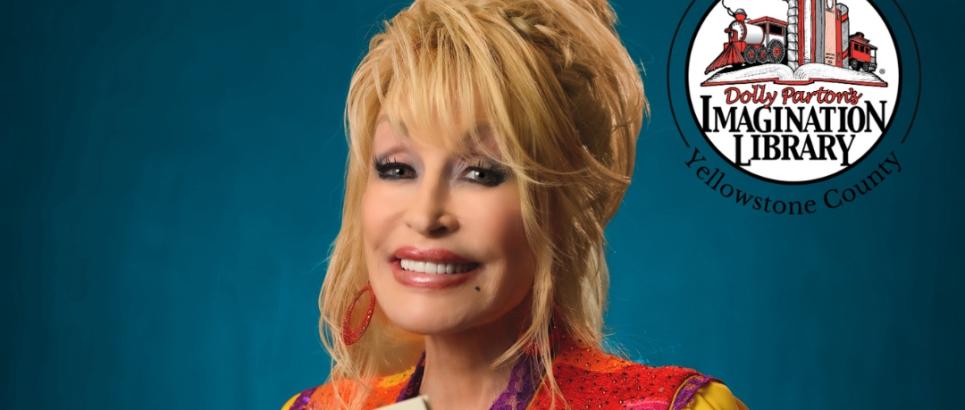 Dolly Parton holds two books while smiling