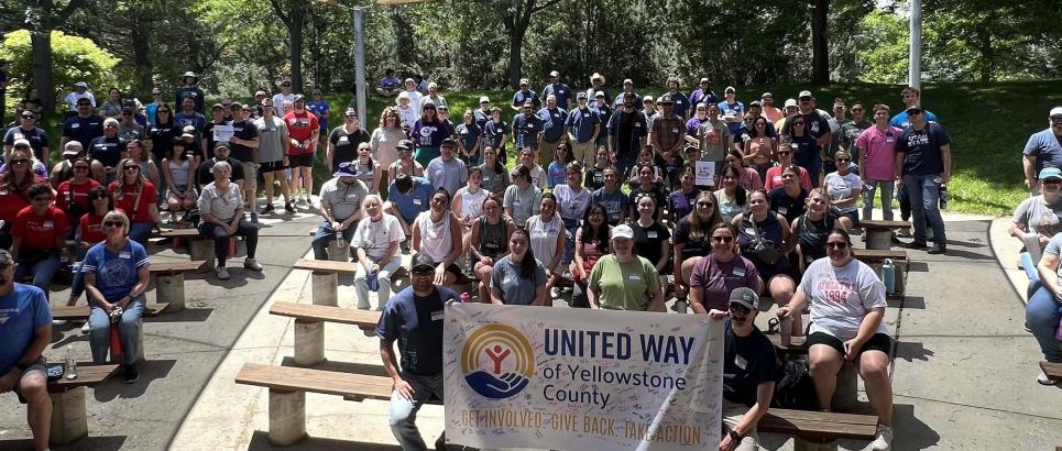 About 100 volunteers pose for a photo