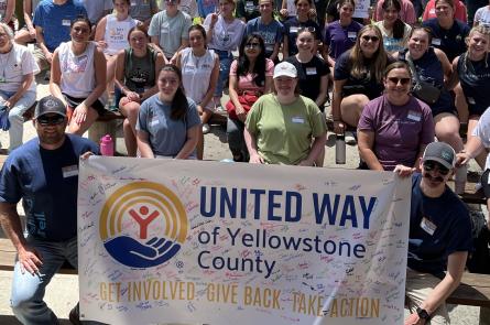 A group of people hold a banner at Day of Action