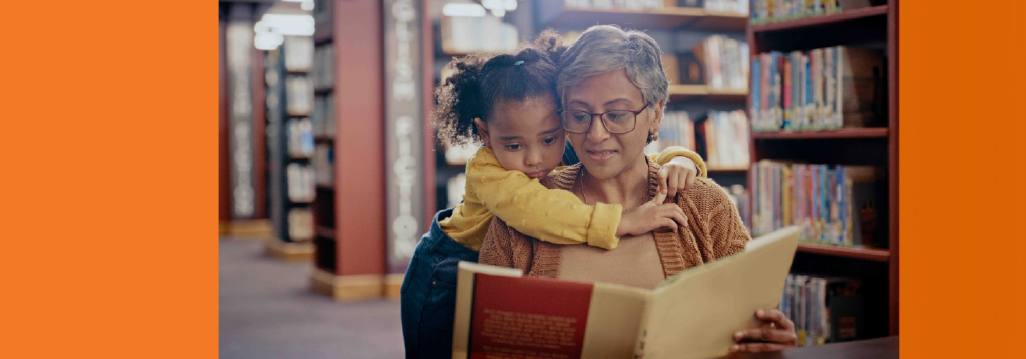 A woman reads to a small child