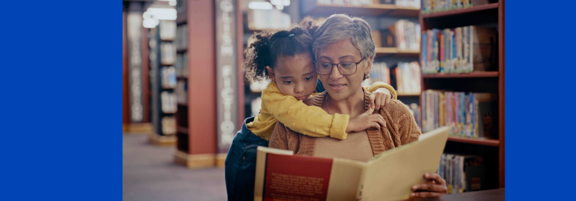 A woman reads to a small child