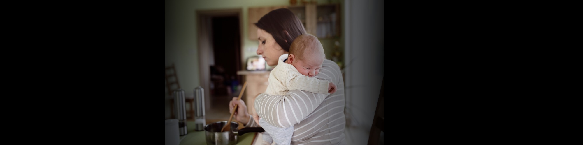 A mom holds a baby