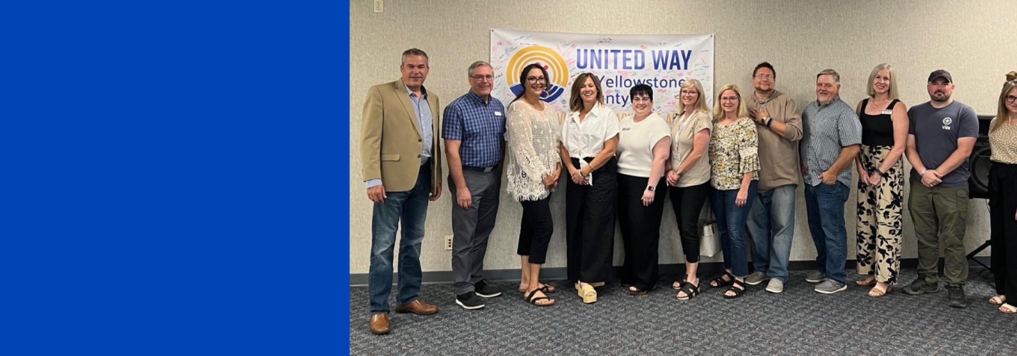 Representatives from agencies who received a Community Investment Grant pose for a photo