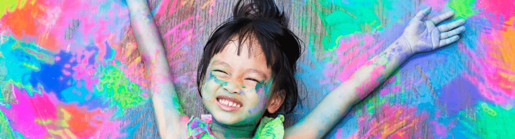Girls Smiling with Paint Around Her